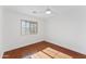 Well-lit bedroom featuring hardwood floors and a window at 3526 W Owens Ct, Anthem, AZ 85086