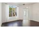 Bright dining room with dark hardwood floors and view to backyard at 4930 S Forest Ave, Gilbert, AZ 85298