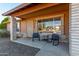 Covered porch with rocking chairs, offering a welcoming entryway at 5539 W Charleston Ave, Glendale, AZ 85308