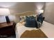 Cozy bedroom with plush bedding and nightstands at 6125 E Indian School Rd # 164, Scottsdale, AZ 85251
