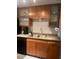 Updated kitchen with wood cabinetry and stainless steel sink at 6125 E Indian School Rd # 164, Scottsdale, AZ 85251