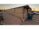 Side view of a tan manufactured home with covered patio at 6723 W Fillmore St # 301, Phoenix, AZ 85043