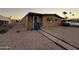 Front view of a tan manufactured home with a walkway at 6723 W Fillmore St # 301, Phoenix, AZ 85043