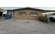 Tan single-wide manufactured home with gravel landscaping at 6723 W Fillmore St # 301, Phoenix, AZ 85043