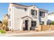 Two-story home with white stucco exterior, brown garage door, and landscaping at 678 N Bay Dr, Gilbert, AZ 85233