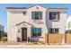 Two-story home with white stucco exterior, brown garage door, and landscaping at 678 N Bay Dr, Gilbert, AZ 85233