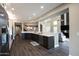 Modern kitchen with dark cabinetry and granite countertops at 7272 E Gainey Ranch Rd # 51, Scottsdale, AZ 85258