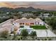 Luxury home with a large backyard, pool, and basketball court; mountain views at 7543 N Mockingbird Ln, Paradise Valley, AZ 85253