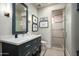 Modern bathroom with a large vanity and a walk-in shower at 7543 N Mockingbird Ln, Paradise Valley, AZ 85253