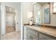 Bathroom with double vanity and travertine flooring at 7543 N Mockingbird Ln, Paradise Valley, AZ 85253