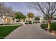 Stunning home exterior at dusk with a long driveway at 7543 N Mockingbird Ln, Paradise Valley, AZ 85253