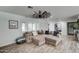 Bright and airy living room featuring a large sectional sofa and hardwood floors at 7801 N 6Th St, Phoenix, AZ 85020