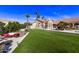 Artificial turf backyard with seating area and games at 9840 N 111Th Pl, Scottsdale, AZ 85259