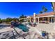Resort-style backyard with pool, spa, fountain, and ample seating at 9840 N 111Th Pl, Scottsdale, AZ 85259
