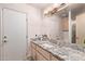 Bathroom with granite countertop, single sink and large mirror at 9840 N 111Th Pl, Scottsdale, AZ 85259