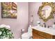 Elegant bathroom with ornate mirror and marble vanity at 9840 N 111Th Pl, Scottsdale, AZ 85259