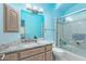 Bathroom with granite vanity, shower/tub combo, and light wood cabinets at 9840 N 111Th Pl, Scottsdale, AZ 85259
