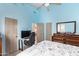 Bedroom with a double bed, dresser, and home office area at 9840 N 111Th Pl, Scottsdale, AZ 85259