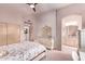 Bedroom with ensuite bathroom, and ornate furniture at 9840 N 111Th Pl, Scottsdale, AZ 85259