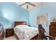 Bedroom with a double bed, ceiling fan and gaming chair at 9840 N 111Th Pl, Scottsdale, AZ 85259