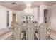 Formal dining room with ornate chairs and a crystal chandelier at 9840 N 111Th Pl, Scottsdale, AZ 85259