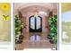 Elegant entryway with double doors and a crystal chandelier at 9840 N 111Th Pl, Scottsdale, AZ 85259