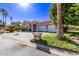 Single-story home with tile roof, two-car garage, and landscaped front yard at 9840 N 111Th Pl, Scottsdale, AZ 85259