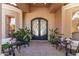 Elegant entry with double doors, plants, and side windows at 9840 N 111Th Pl, Scottsdale, AZ 85259