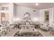 Ornate furniture and a neutral color palette grace this living room at 9840 N 111Th Pl, Scottsdale, AZ 85259