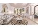 Elegant living room boasts ornate furniture and large windows at 9840 N 111Th Pl, Scottsdale, AZ 85259