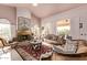 Spacious living room with a fireplace and ample natural light at 9840 N 111Th Pl, Scottsdale, AZ 85259
