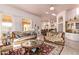 Elegant living room featuring ornate furniture and large windows at 9840 N 111Th Pl, Scottsdale, AZ 85259