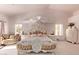 Spacious main bedroom with ornate bed and sitting area at 9840 N 111Th Pl, Scottsdale, AZ 85259