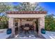 Covered patio with built-in grill and seating area at 9840 N 111Th Pl, Scottsdale, AZ 85259