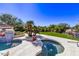 Two-tiered pool and spa with surrounding landscaping at 9840 N 111Th Pl, Scottsdale, AZ 85259
