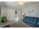 Bedroom with a comfy couch and ceiling fan at 10412 W Audrey Dr, Sun City, AZ 85351