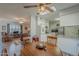Open concept kitchen and dining area with wood table at 10412 W Audrey Dr, Sun City, AZ 85351