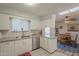 Bright kitchen featuring granite countertops and a dining area at 10412 W Audrey Dr, Sun City, AZ 85351