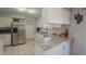 Modern kitchen with stainless steel appliances and granite countertops at 10412 W Audrey Dr, Sun City, AZ 85351
