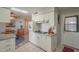 Updated kitchen with white cabinets and granite countertops at 10412 W Audrey Dr, Sun City, AZ 85351