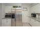 Modern kitchen with stainless steel refrigerator and granite countertops at 10412 W Audrey Dr, Sun City, AZ 85351