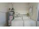 Laundry room with washer, dryer, and extra shelving at 10412 W Audrey Dr, Sun City, AZ 85351