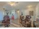 Open living space with comfy seating and wood floors at 10412 W Audrey Dr, Sun City, AZ 85351