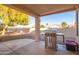 Covered patio with built-in grill and backyard access at 10714 E Nacoma Dr, Sun Lakes, AZ 85248