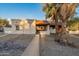 Front view of single story home with walkway and mature palm trees at 10807 W Northern Ave # 133, Glendale, AZ 85307