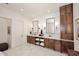 Luxurious bathroom with double vanity, large mirrors, and abundant storage at 11142 E Sorrel Ln, Scottsdale, AZ 85259