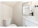 Modern powder room with pedestal sink and floating vanity at 1136 N 84Th Pl, Scottsdale, AZ 85257
