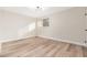Second bedroom with large window and neutral color palette at 1136 N 84Th Pl, Scottsdale, AZ 85257