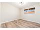 Third bedroom with neutral walls and wood-look flooring at 1136 N 84Th Pl, Scottsdale, AZ 85257
