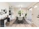 Modern dining room with kitchen view and access to patio at 1136 N 84Th Pl, Scottsdale, AZ 85257